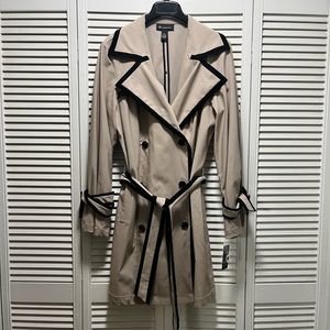 Tan trench coat with black trim. New with tags.